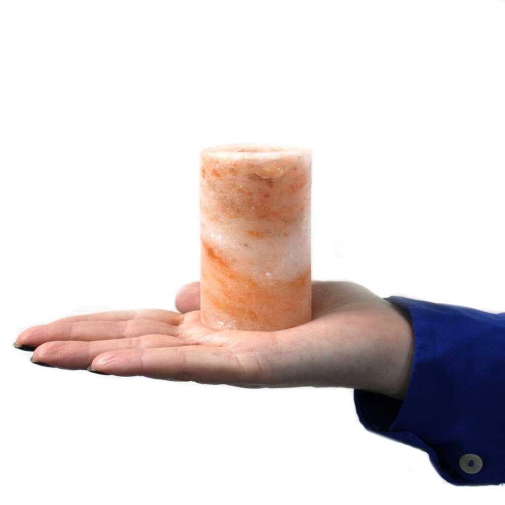 one rock salt shot glass on outstretched palm