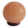 an Himalayan salt lamp ball on a wooden base