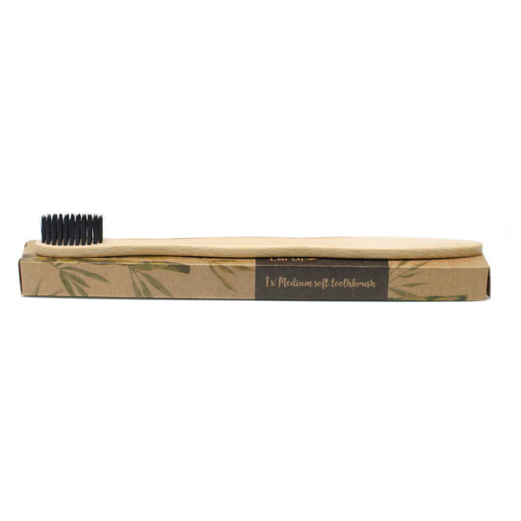 Bamboo Toothbrush sitting on a cardboard box.