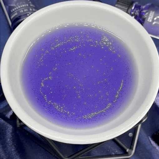 Zodiac Fragrance Oil in a white dish showing glitter.