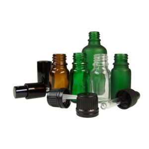 a selection of empty aromatherapy bottles in green and brown