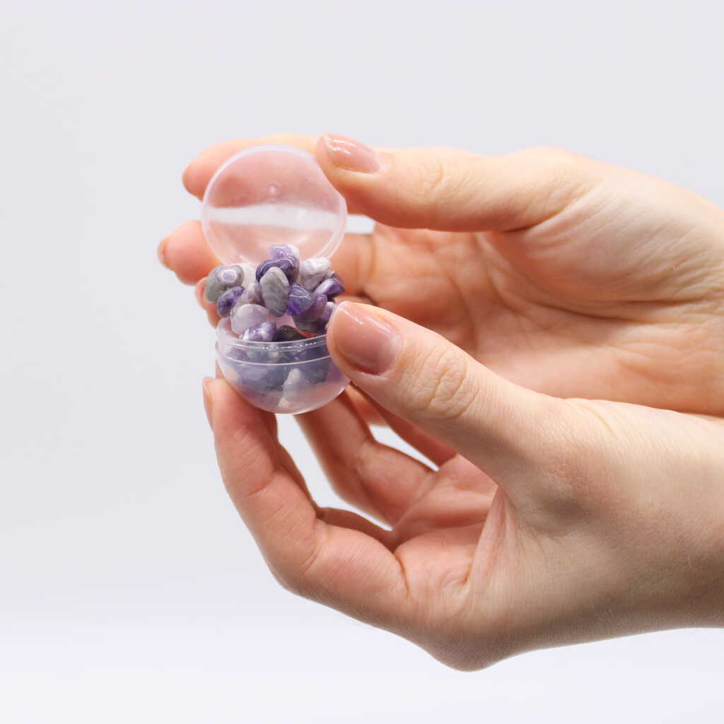 Amethyst Gemstone Bracelet in egg-shaped container.