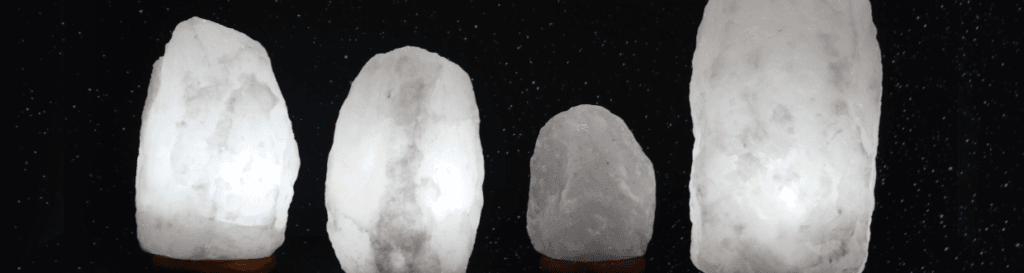 several white Himalayan salt lamps