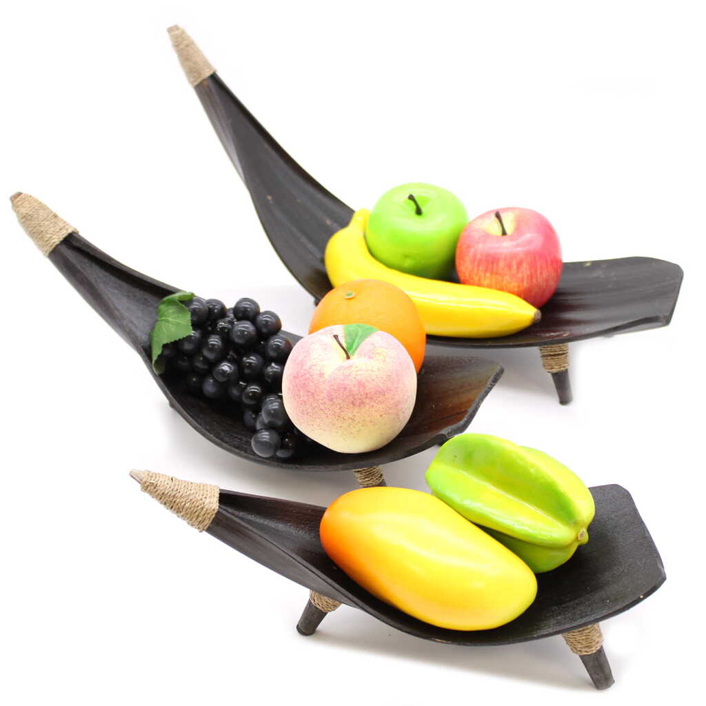 set of three coconut leaf fruit bowls, with fruit