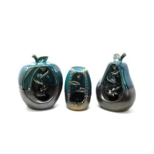 a set of three green and black ceramic backflow burners