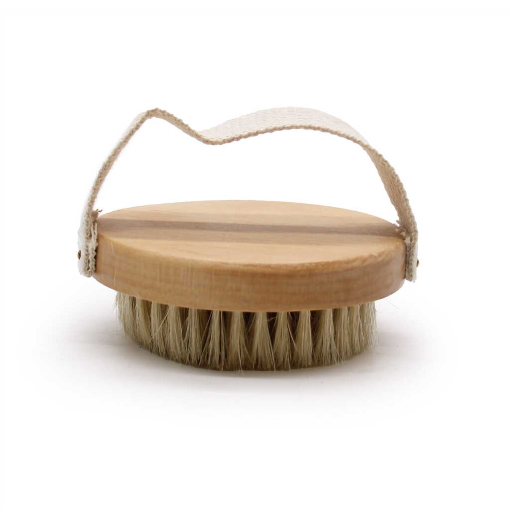 a hand held body scrub brush showing the side view