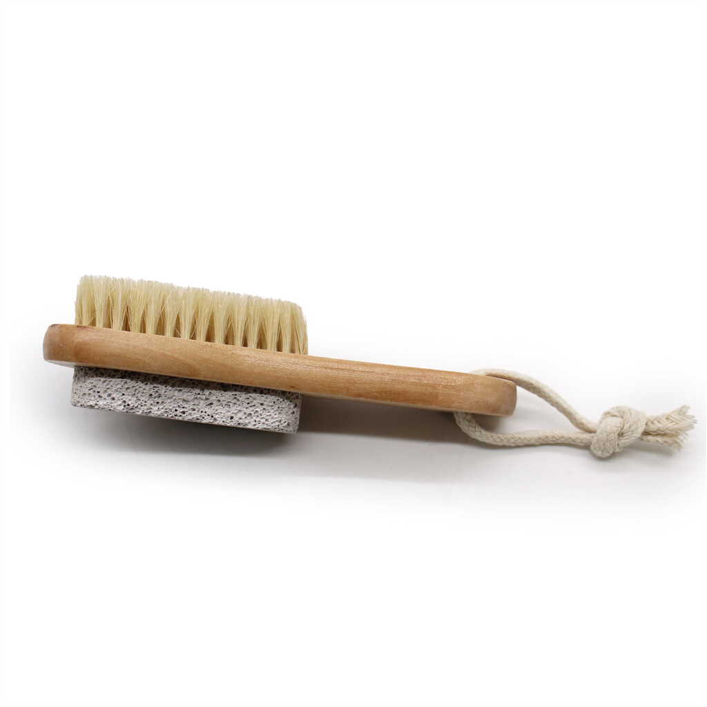 a face and body brush with pumice on the back