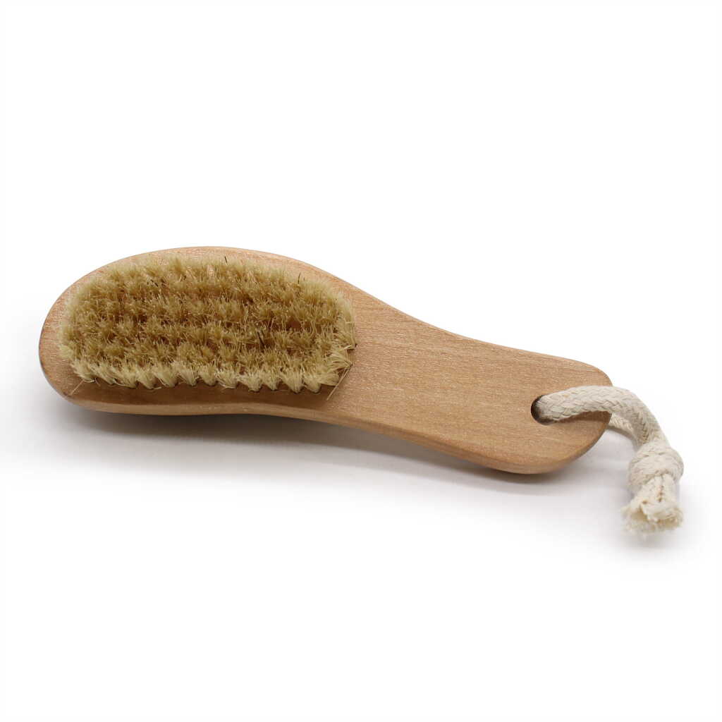a face and body brush with pumice on the back - looking at the bristles