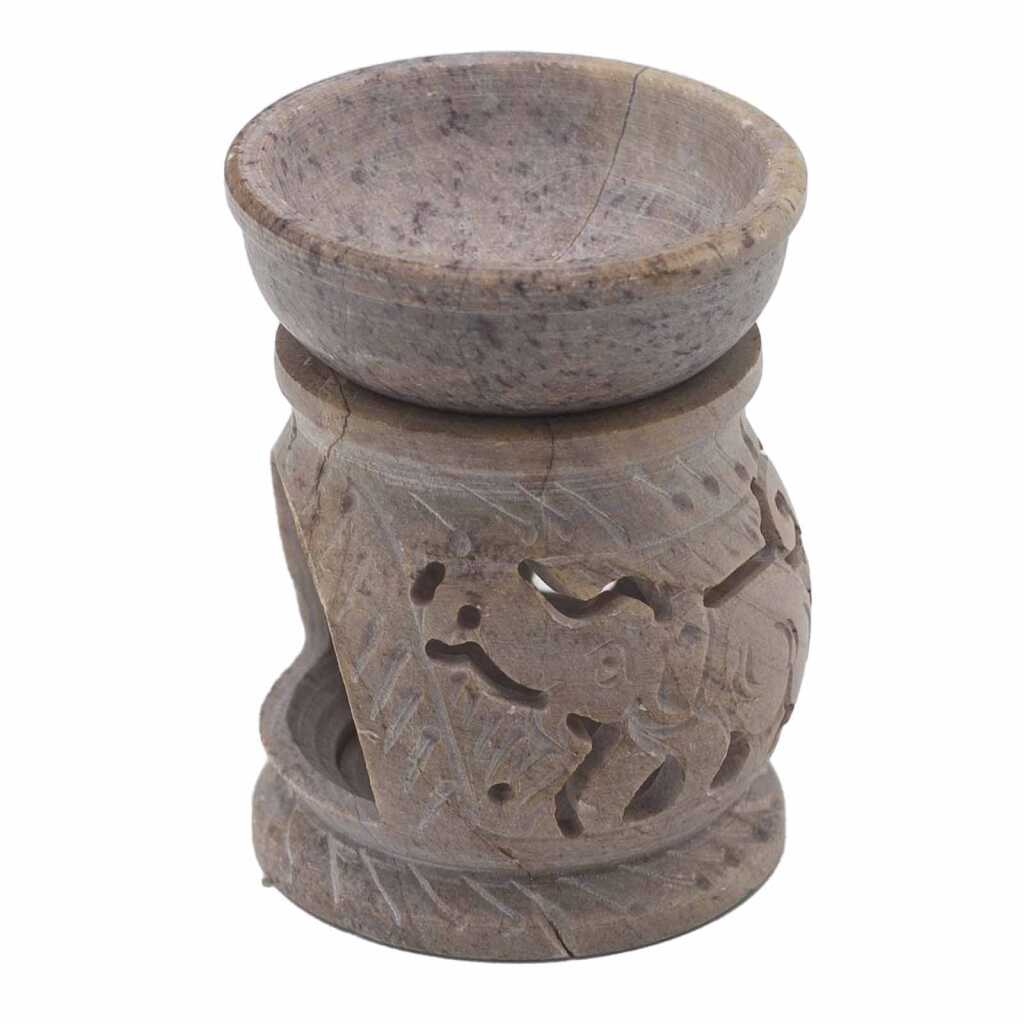 a soapstone oil burner with an elephant design.