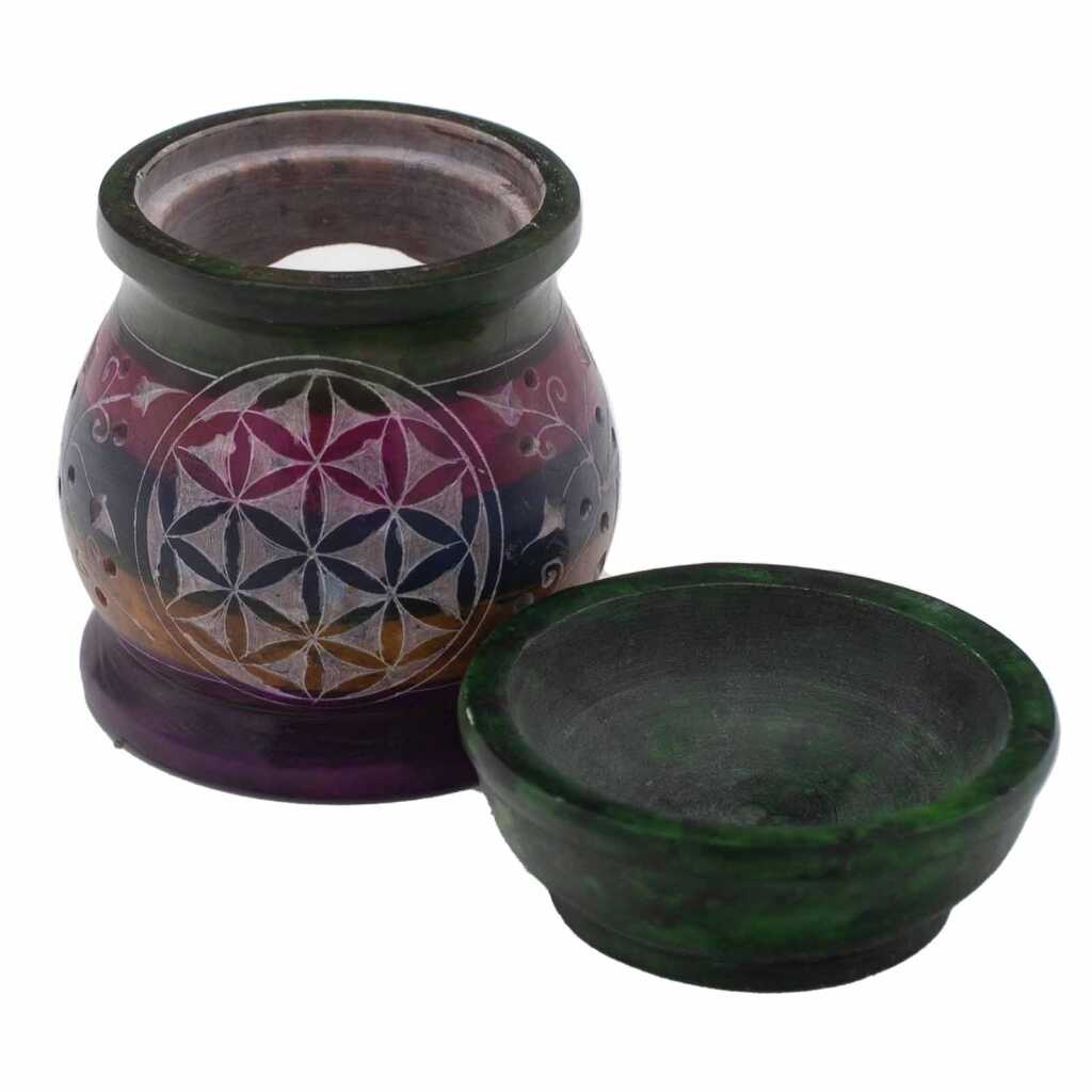 a five coloured soapstone oil burner with a flower of life design, showing the base and the top bowl separately.