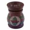 a five coloured soapstone oil burner with a hamsa design.
