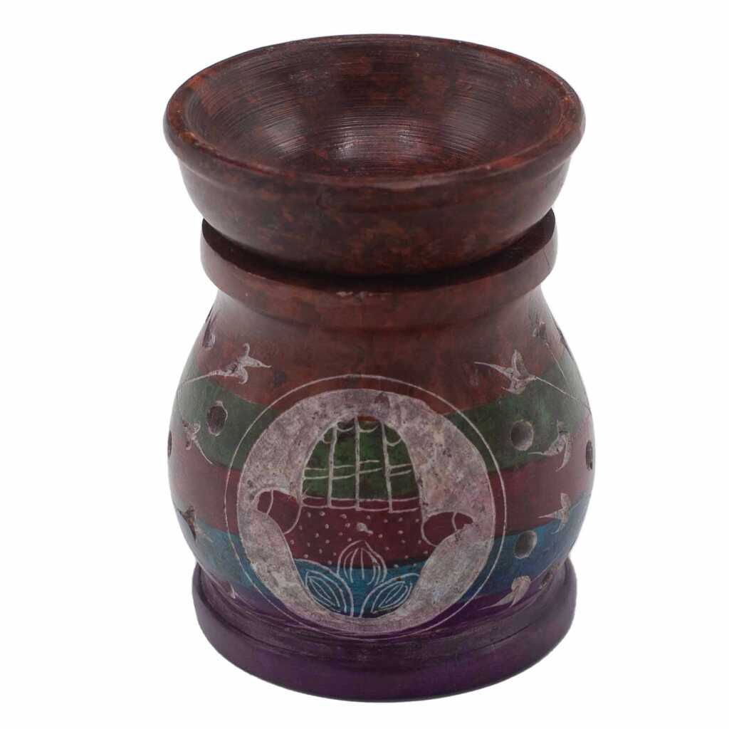 a five coloured soapstone oil burner with a hamsa design.
