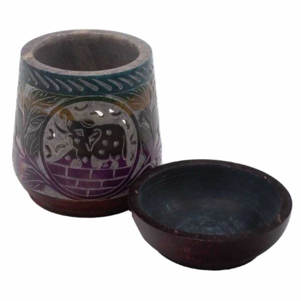 a five coloured soapstone oil burner with an elephant design.