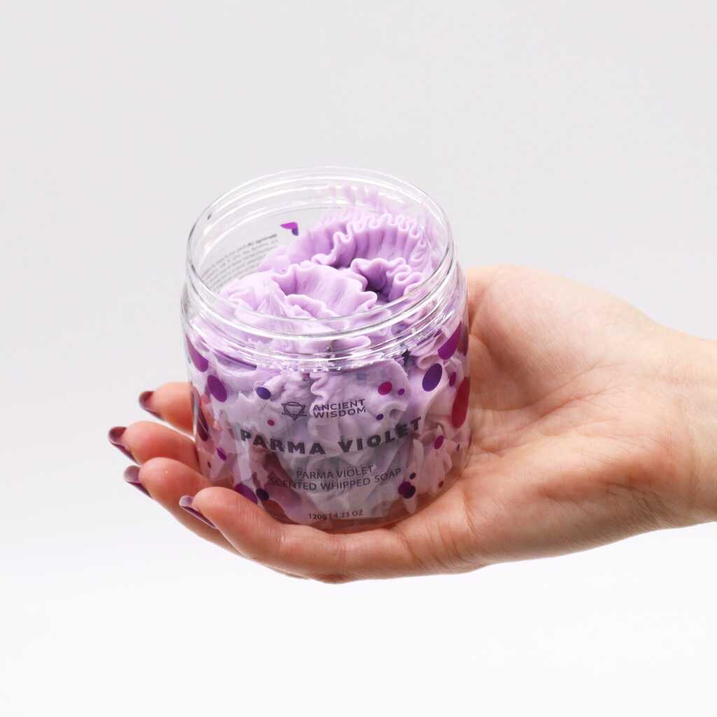 parma violet scented whipped soap - violet - open jar in an open hand.