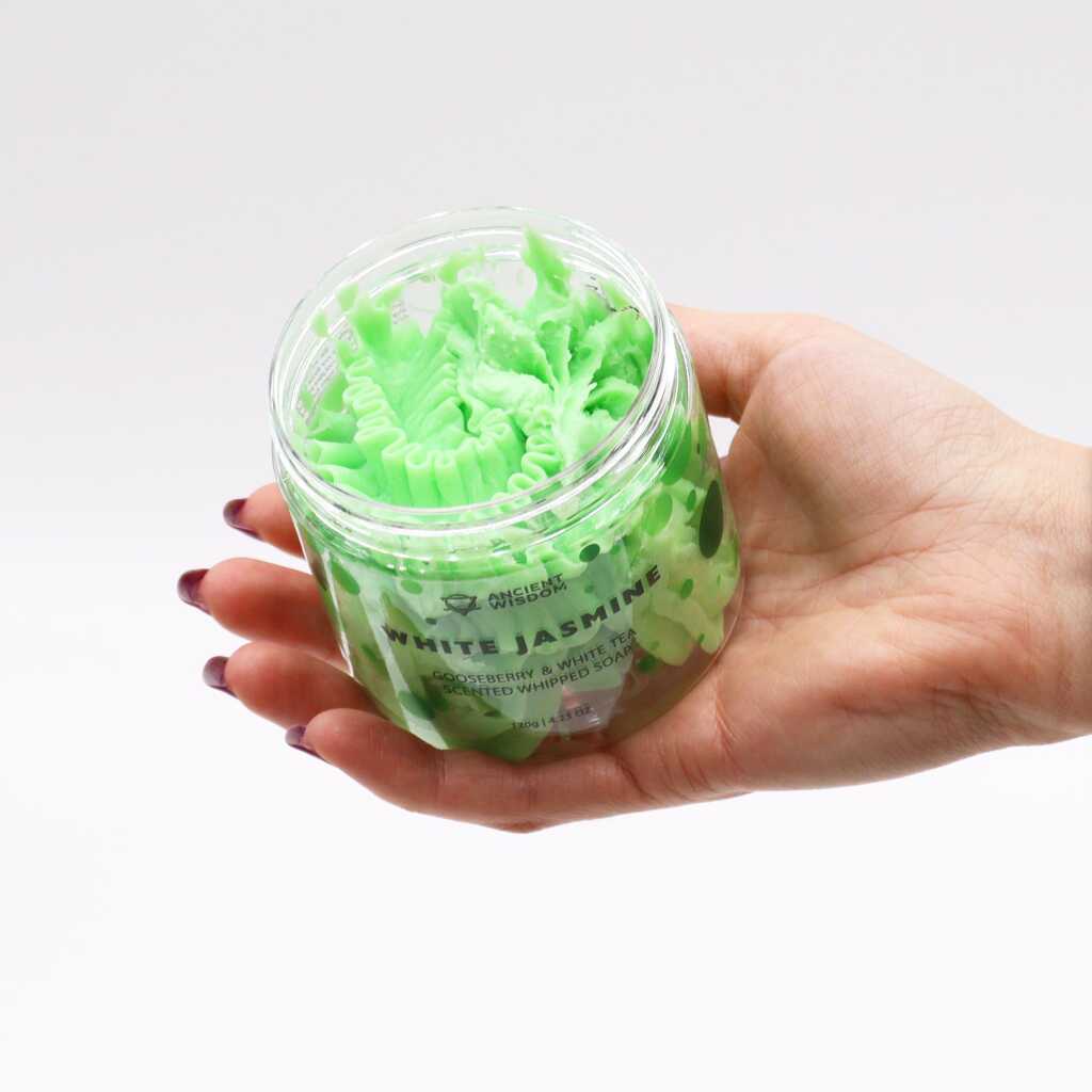 white jasmine scented whipped soap - violet - open jar in open hand