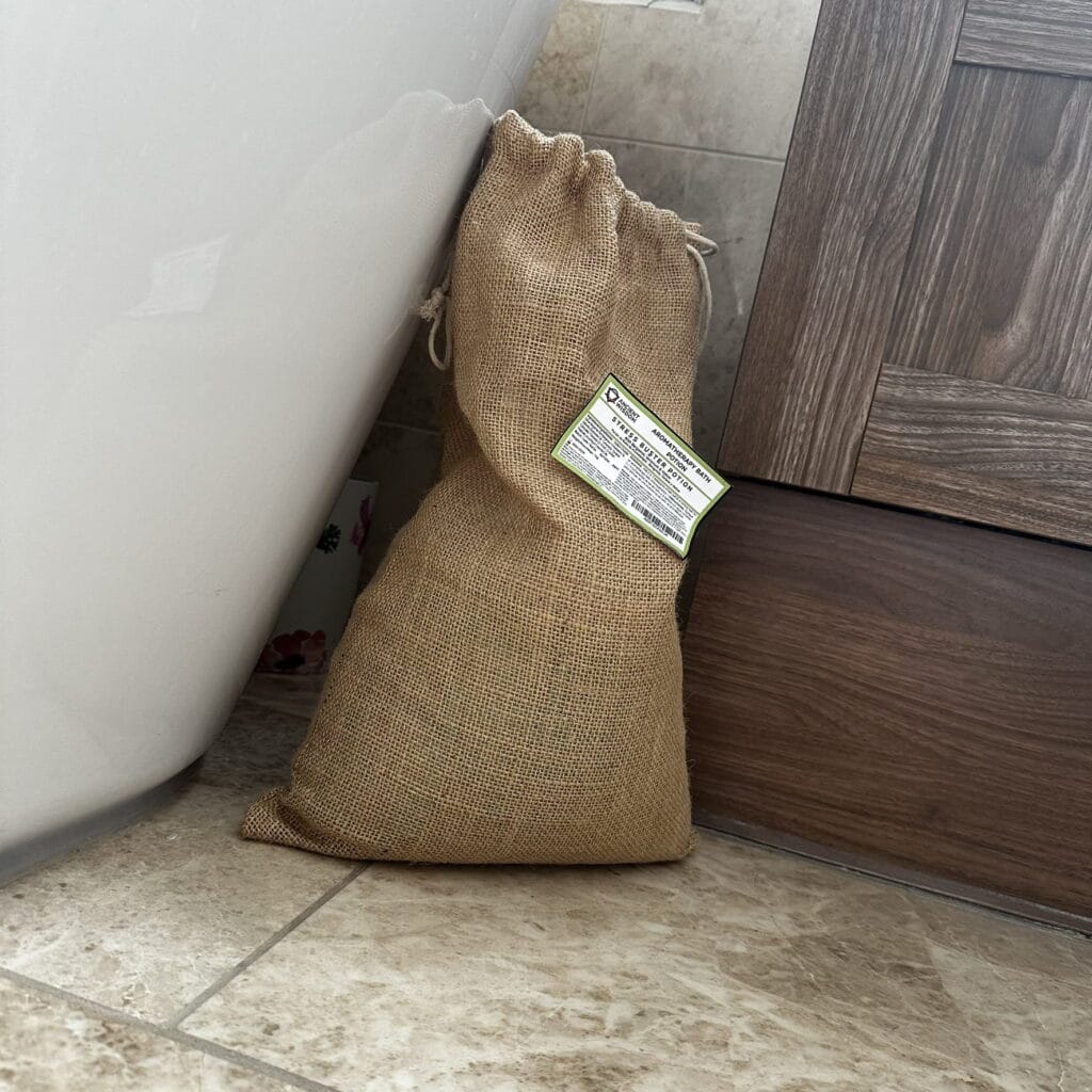 a 7Kg hessian sack of bath salts / bath potion on the bathroom floor