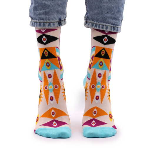 a pair of evil eye hop hare bamboo socks being worn.