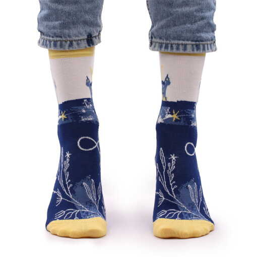 a pair of midnight cat hop hare bamboo socks being worn.