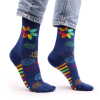a pair of rainbow chakra hop hare bamboo socks being worn.
