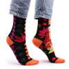 a pair of pink buddha and lotus hop hare bamboo socks being worn.