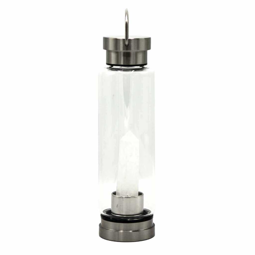 A clear quartz obelisk, crystal infused water bottle