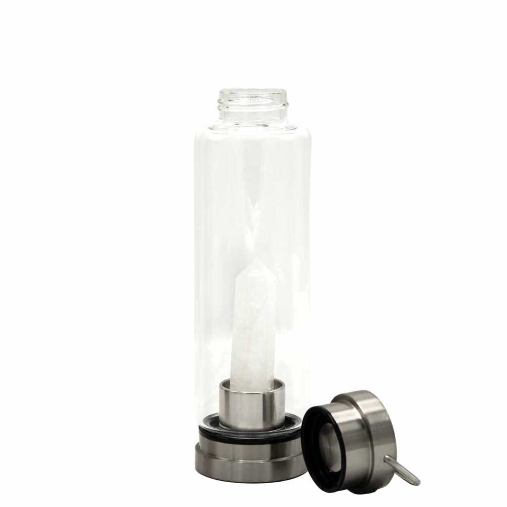 A clear quartz obelisk, crystal infused water bottle