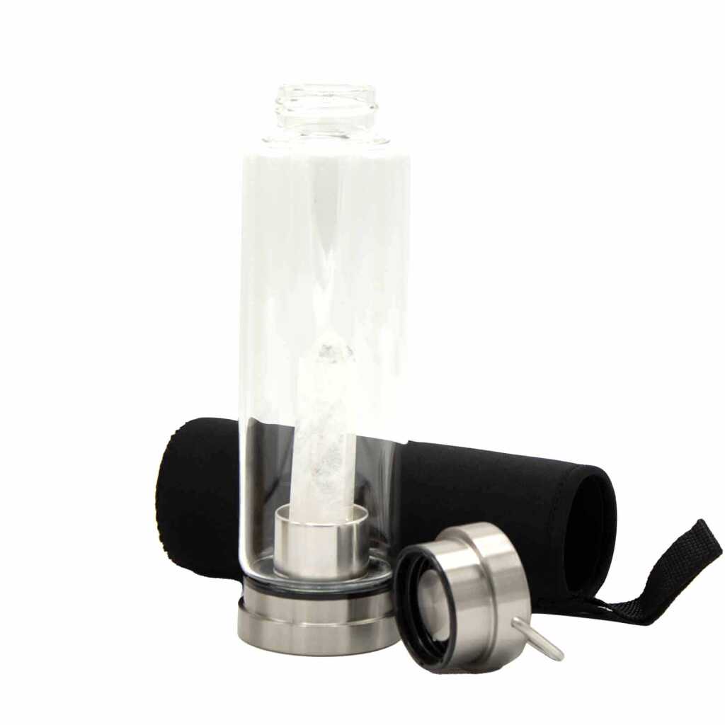 A clear quartz obelisk, crystal infused water bottle
