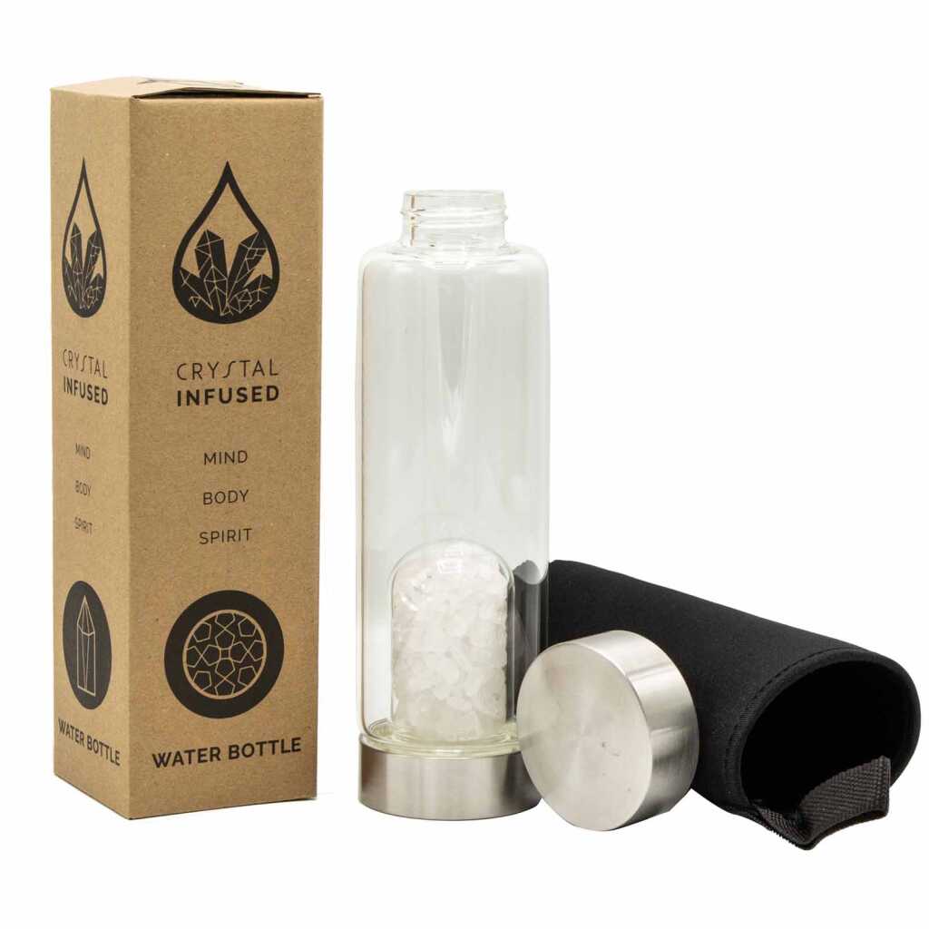 A clear quartz crystal infused water bottle