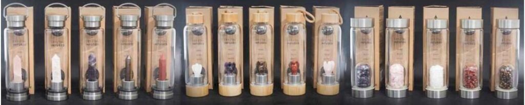 a row of fifteen crystal infused water bottles
