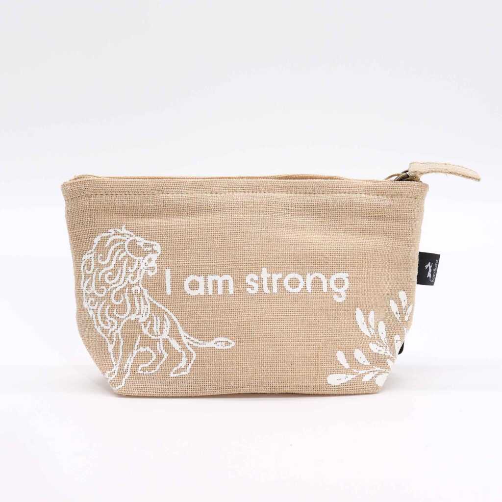 A jute pouch with the words "I am Strong" written on the side.