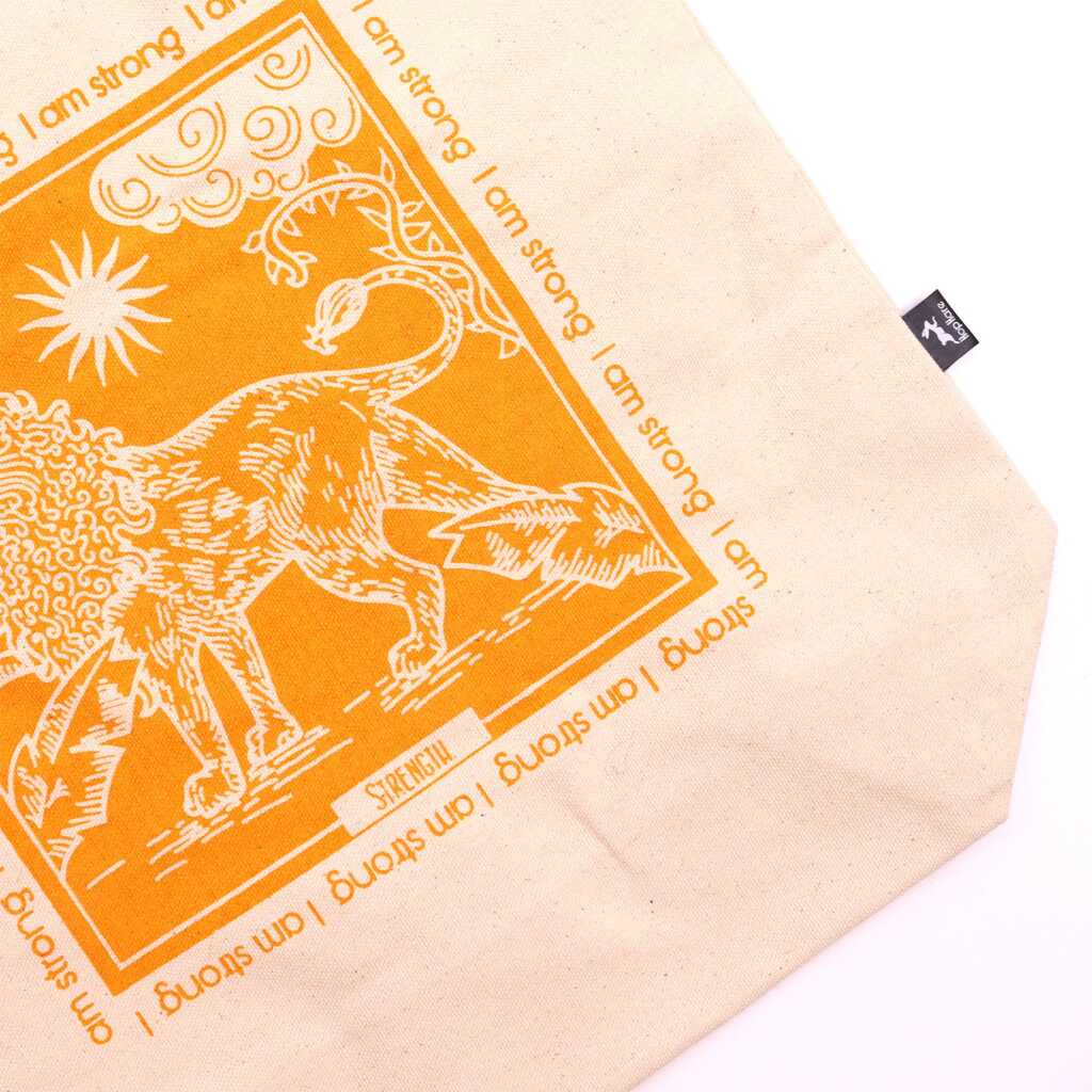 hop hare tote bag with I am Strong logo