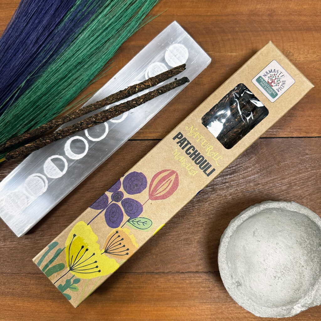 a packet of natural patchouli masala incense sticks on a table top