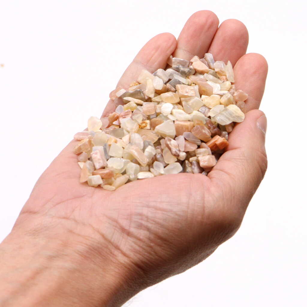 moonstone chips held in an open hand