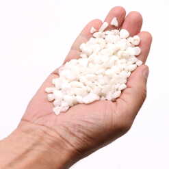 white quartz chips held in an open hand