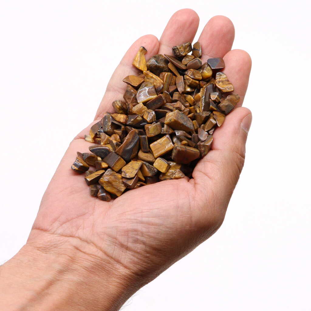 tiger eye chips held in an open hand