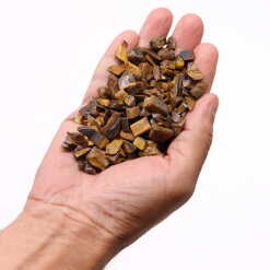 tiger eye chips held in an open hand