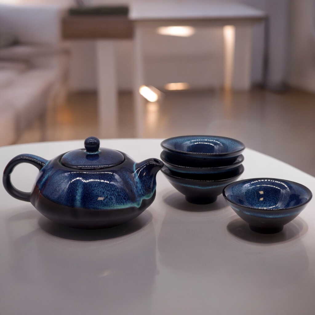 a herbal blues themed teapot set with four matching cups