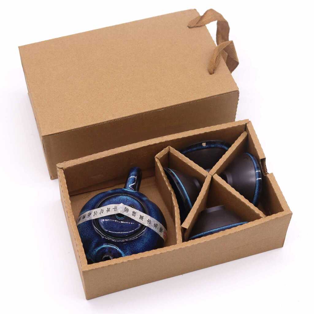 a herbal blues themed teapot set with four matching cups, in a cardboard box