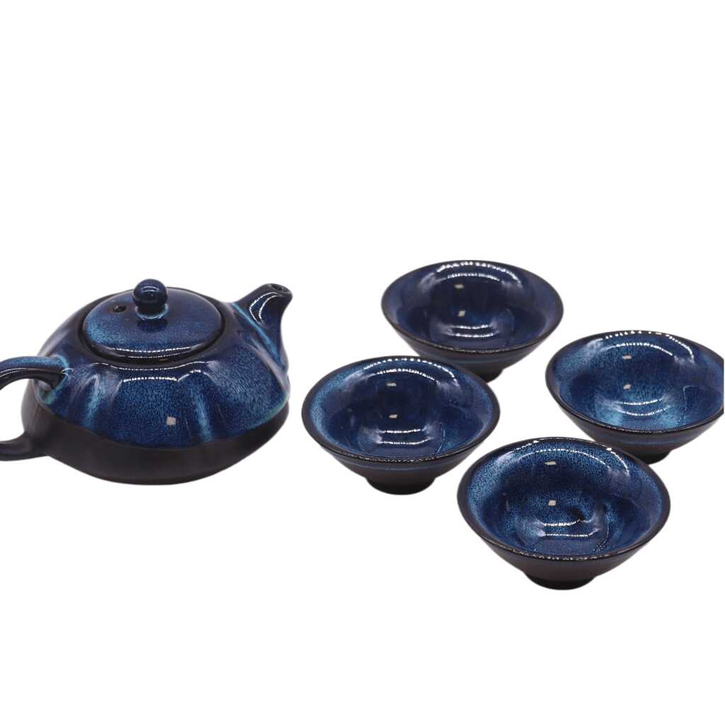 a herbal blues themed teapot set with four matching cups