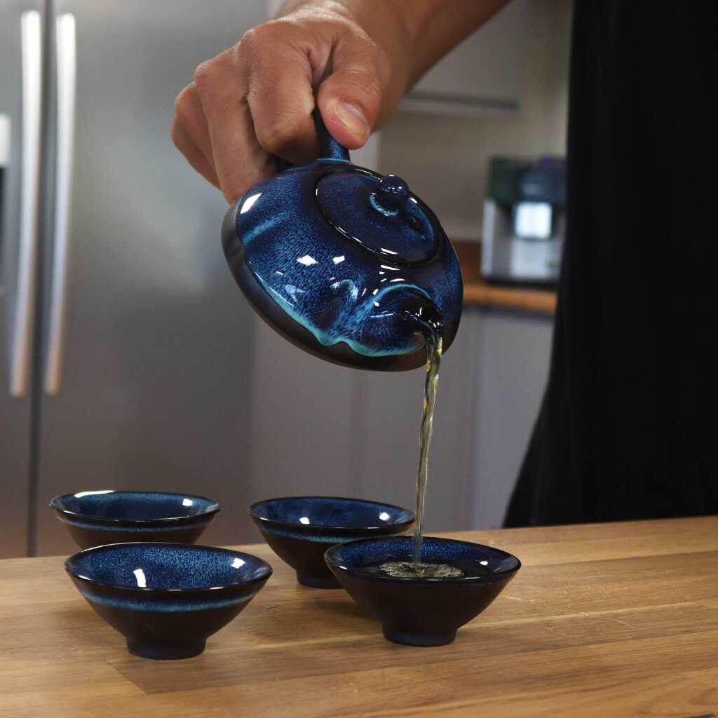 a herbal blues themed teapot set with four matching cups