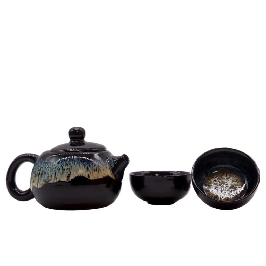 a herbal black glaze themed teapot set with two matching cups