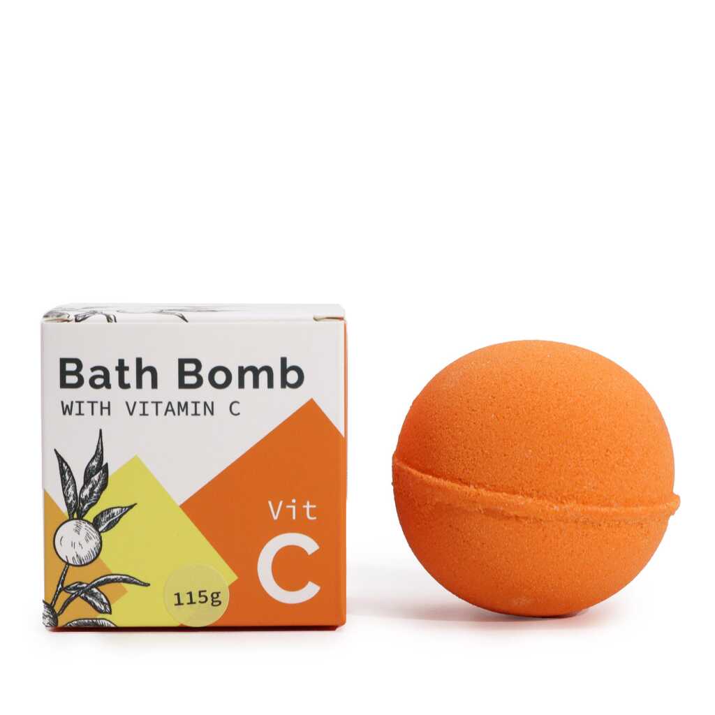 vitamin C infused orange bath bomb alongside its box.