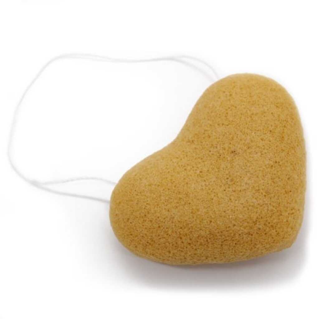 a heart-shaped Japanese Konjac Sponge in a peach colour, on a loop of string