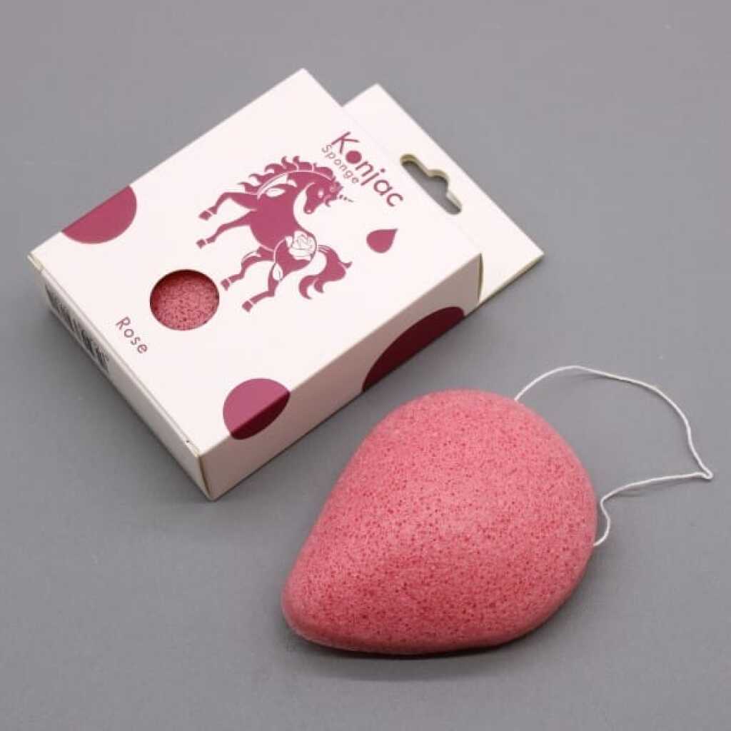 a teardrop konjac sponge infused with rose essence next to a box