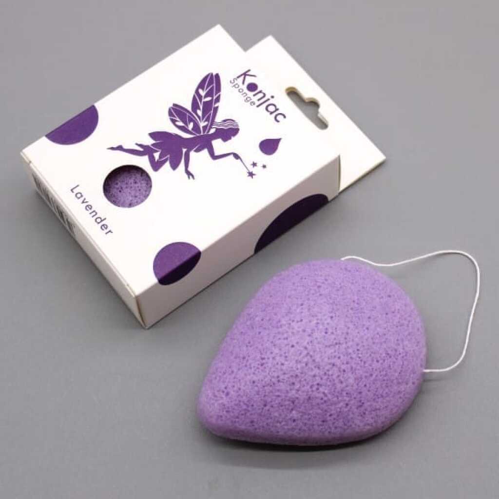 a lavender coloured teardrop konjac sponge infused with lavender, alongside its packaging