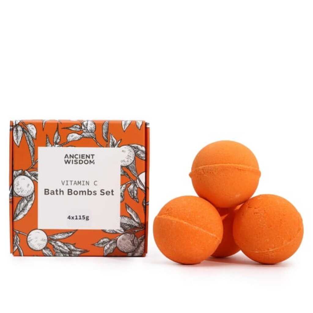 a set of four orange bath bombs with vitamin C alongside the packaging