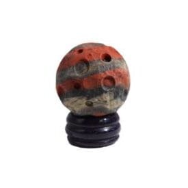 a gemstone planet representing Mars - the red planet