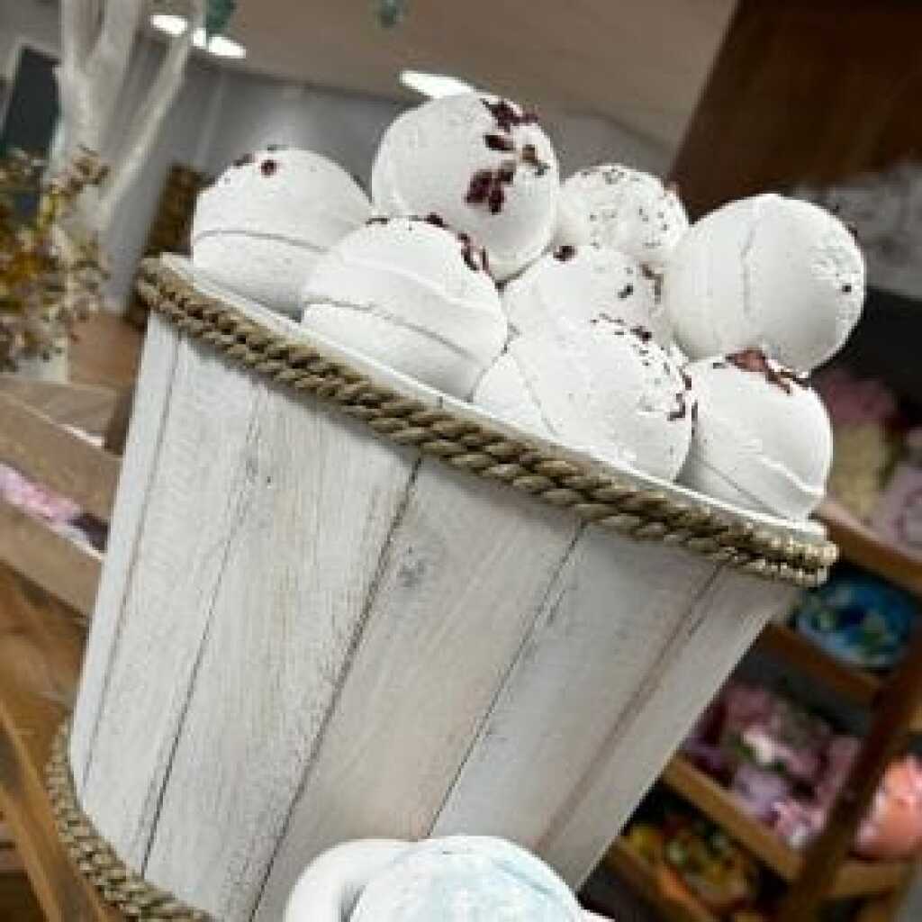 white bath bombs in a wooden bucket