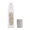 an aromatherapy gemstone roller bottle dispenser with rock quartz and silver cap