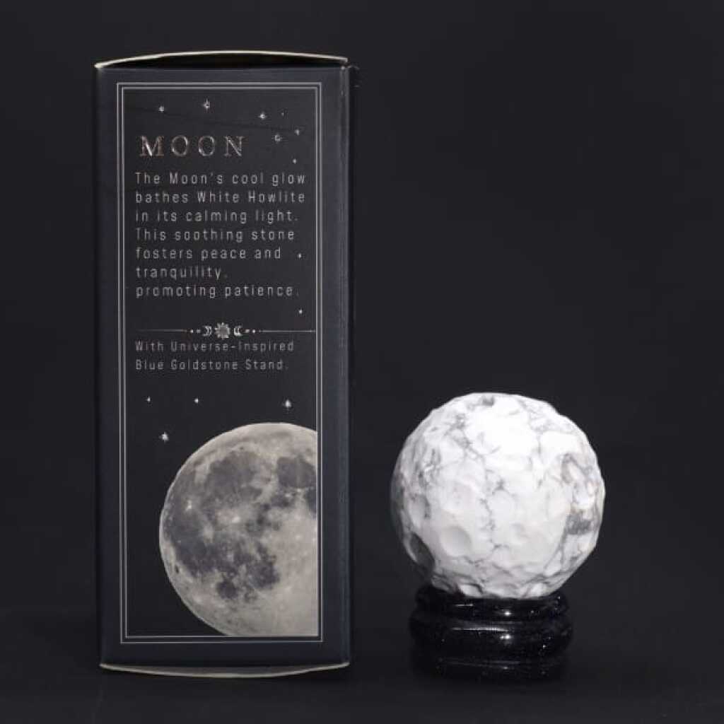 a white howlite gemstone planet representing the moon with packaging